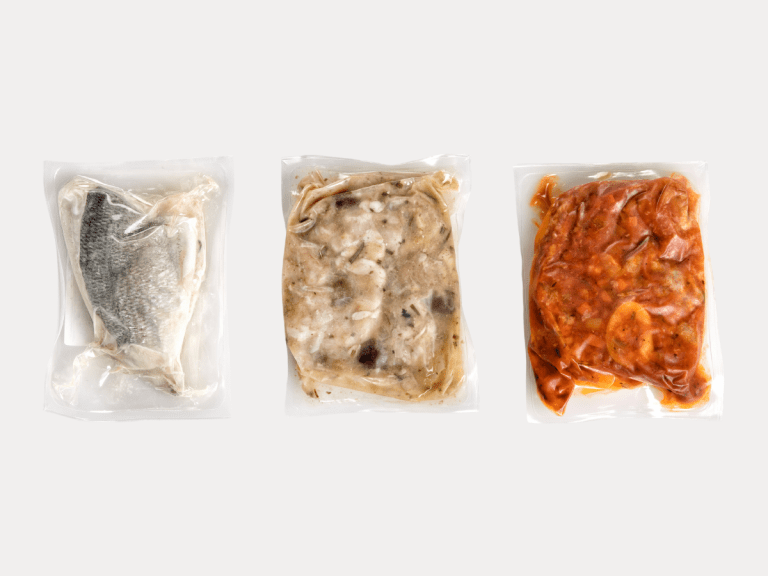 vacuum-sealed frozen food meals in plastic packaging