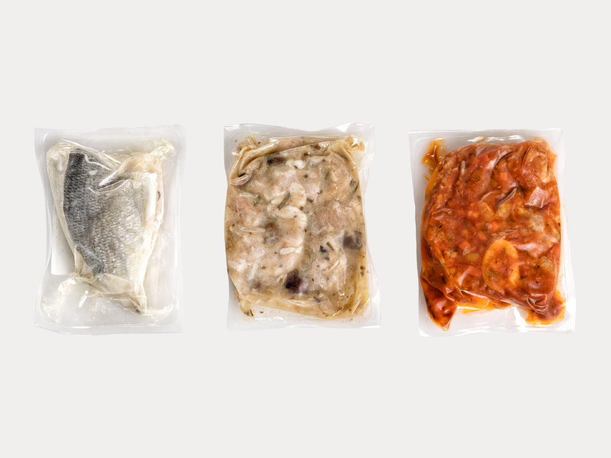 vacuum-sealed frozen food meals in plastic packaging